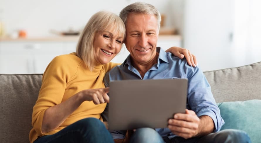 A couple looking at a laptop